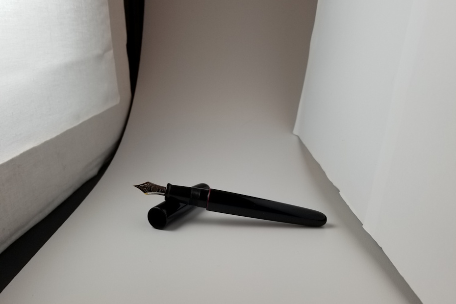 Set up DIY photo diffuser and reflector and place product in between