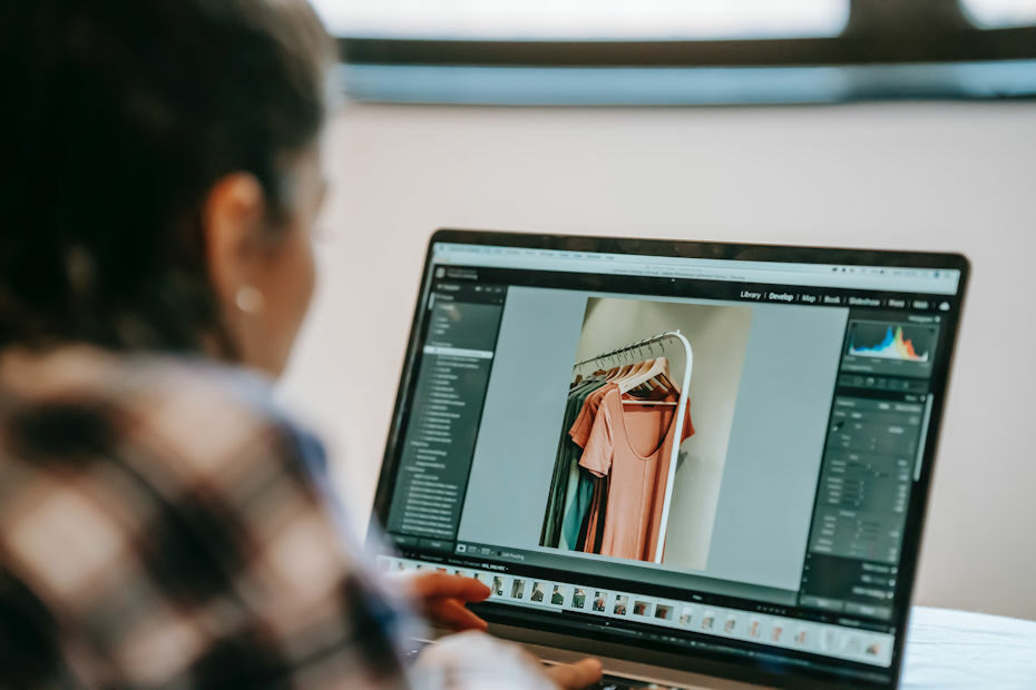 Person using photo editing software to enhance product photo