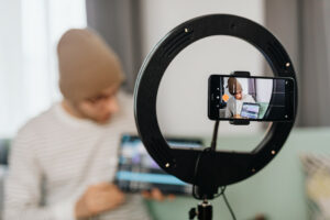 Creator setting up a camera shot as he runs his creator business